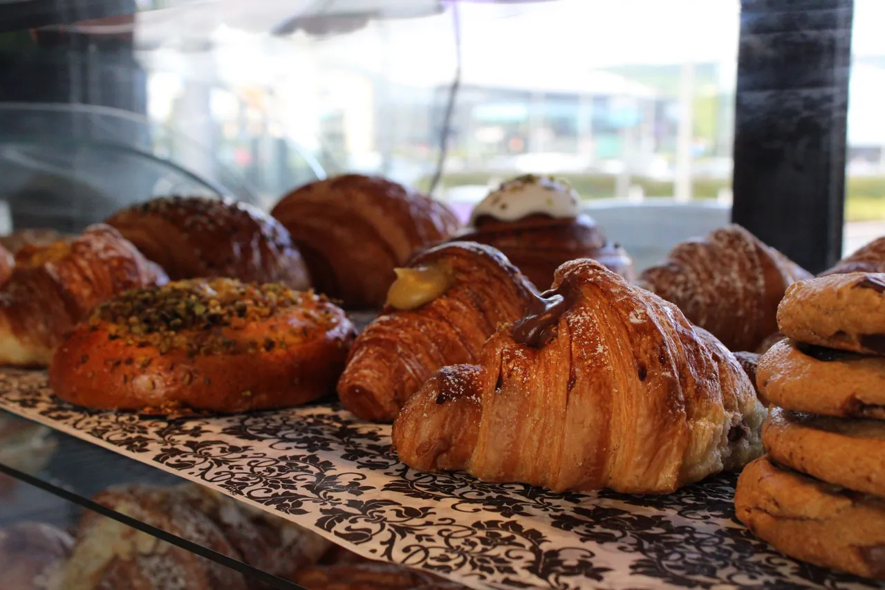 Freshly baked croissants and pastries in the display case