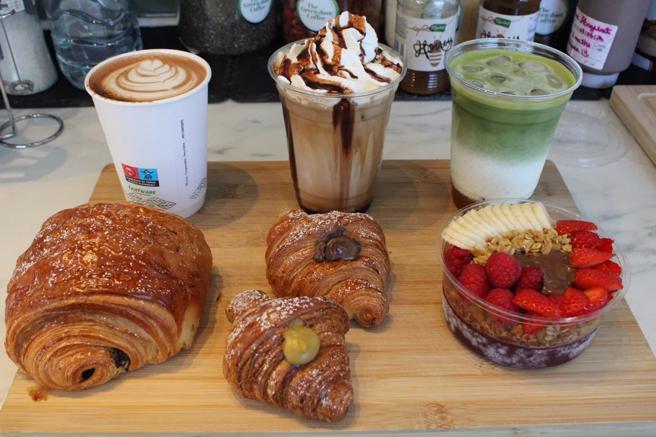 A spread of coffees, an iced mocha, pastries and an açaí bowl